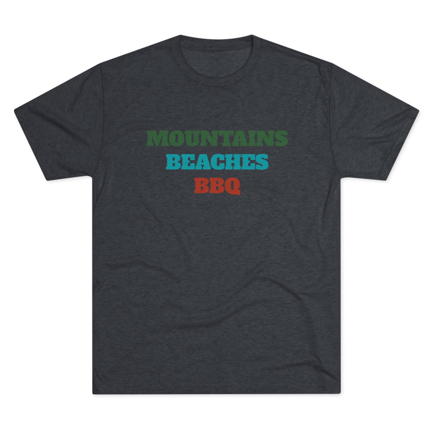 Mountains Beaches BBQ T-shirt in deep green, teal, and rust red stacked text on a dark navy tri-blend shirt.