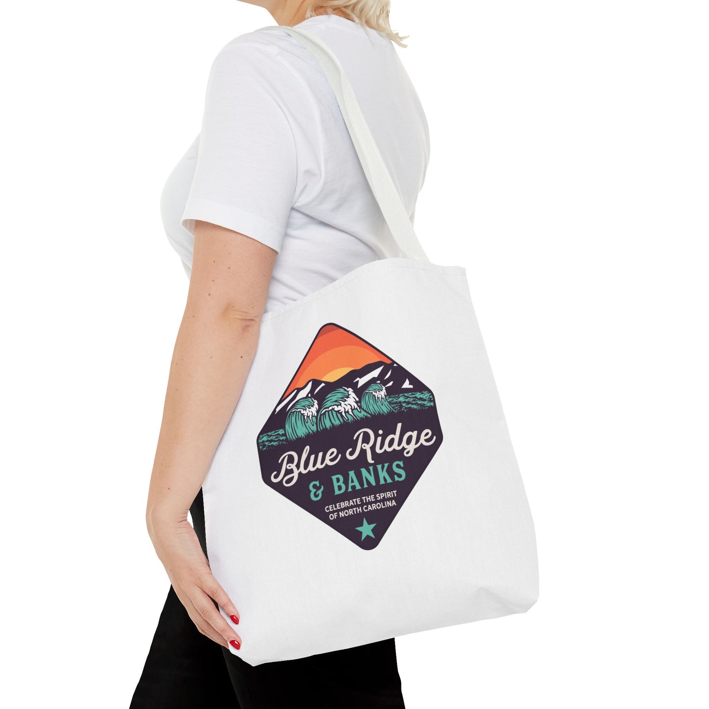 Woman wearing Blue Ridge & Banks tote bag over shoulder showing NC-themed logo design