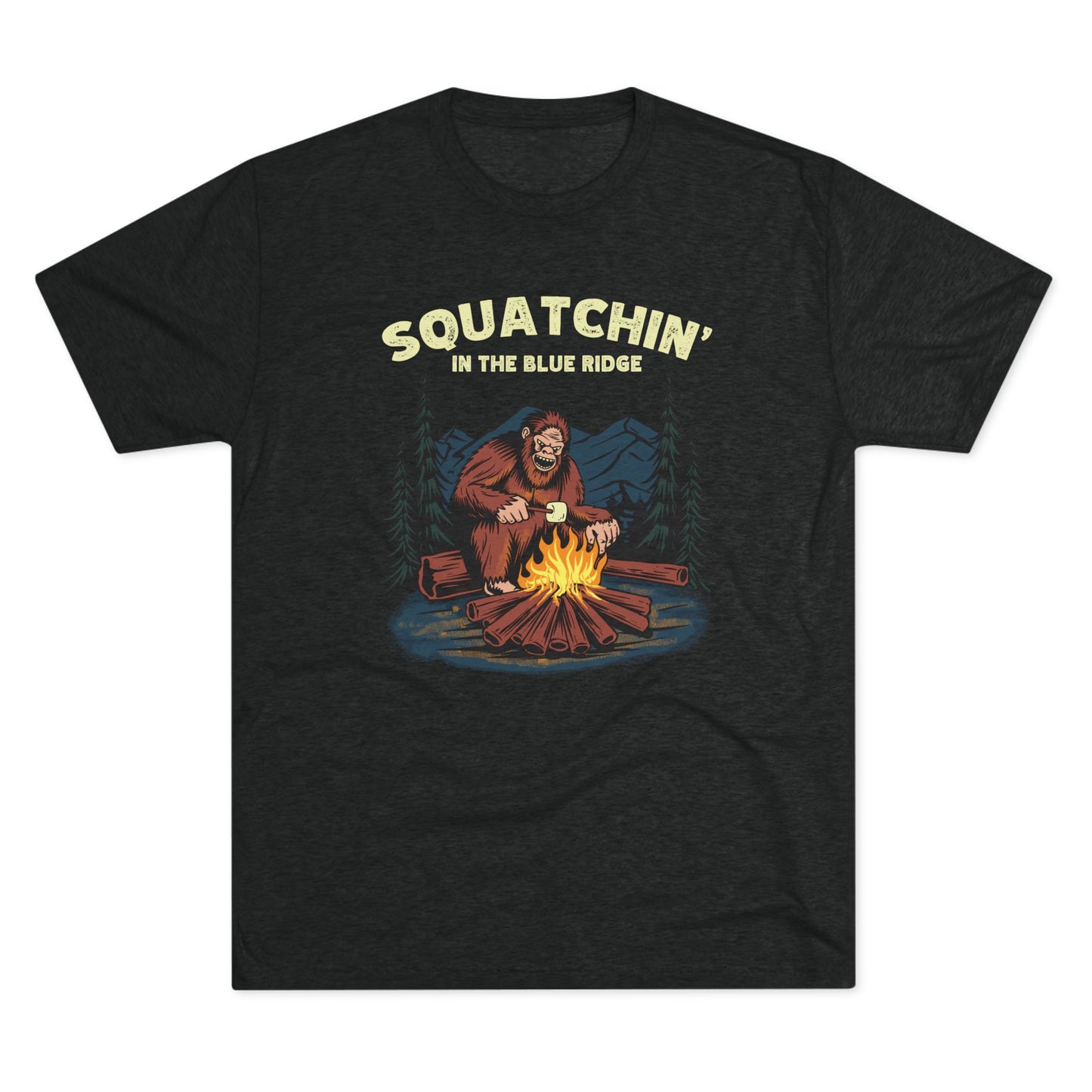 Black t-shirt with a camping Bigfoot roasting marshmallows and "Squatchin' in the Blue Ridge" text.