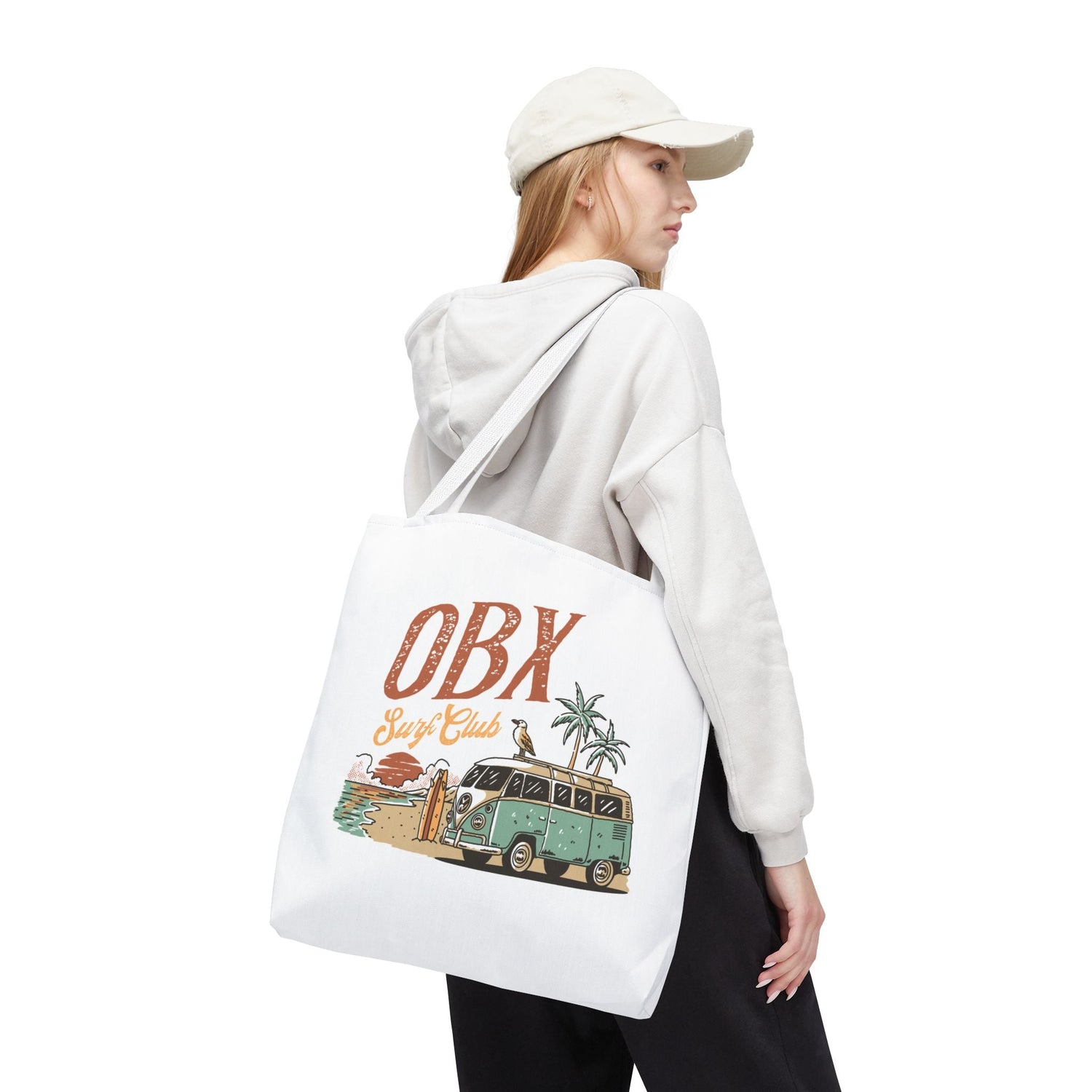 Woman carrying OBX Surf Club tote.