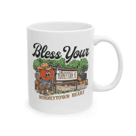 "11oz Ceramic Coffee Mug featuring the playful 'Bless Your Horneytown Heart' design, inspired by the charming town of Horneytown, North Carolina. This white ceramic mug showcases a whimsical, nature-inspired motif, perfect for coffee lovers who appreciate Southern charm and humor. Ideal for adding a touch of personality to your morning routine or as a gift for those who adore North Carolina's unique character."