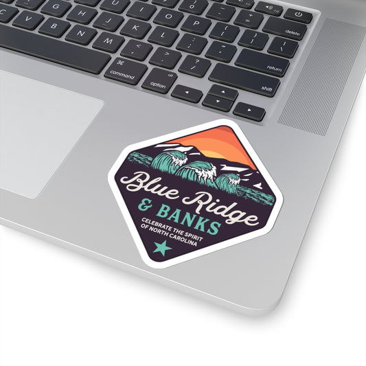 "Blue Ridge & Banks Logo Sticker – Kiss-Cut Vinyl, 2x2 inches, featuring a vibrant North Carolina-inspired design. This durable sticker showcases the iconic Blue Ridge & Banks logo, capturing the essence of North Carolina's natural beauty. Perfect for personalizing laptops, water bottles, or notebooks, this sticker embodies a love for the great outdoors and the scenic landscapes of the Blue Ridge Mountains."