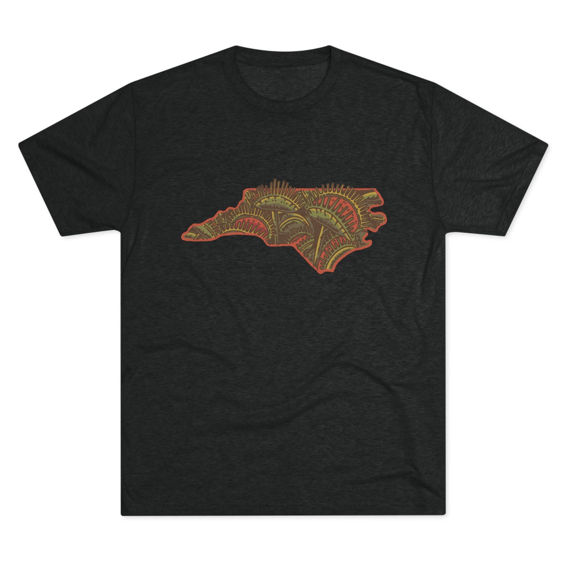 Black t-shirt featuring a vibrant graphic of North Carolina filled with Venus flytraps, printed on the front.