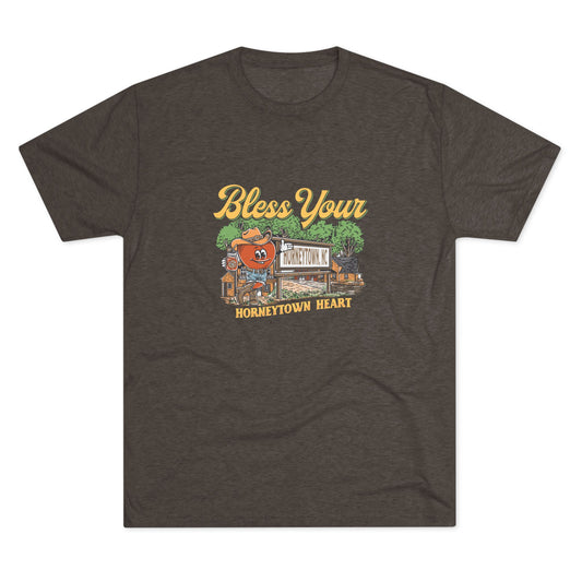 Macchiato brown t-shirt with “Bless Your Horneytown Heart” graphic featuring a NC sign, cartoon heart, and rustic background.