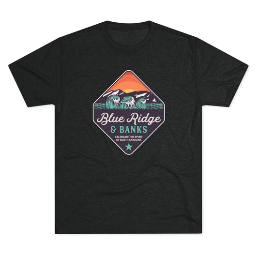 Front of black T-shirt with a colorful diamond-shaped Blue Ridge & Banks graphic featuring ocean waves, mountains, and sunset.
