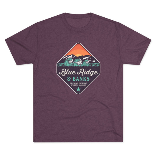 Front of purple T-shirt with a colorful diamond-shaped Blue Ridge & Banks graphic featuring ocean waves, mountains, and sunset.