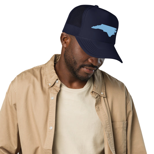 "Black Foam Trucker Hat featuring Baby Blue NC State Shape - Stylish and Comfortable Accessory with North Carolina-Inspired Design. Perfect for Outdoor Adventures and Casual Wear. Available in Multiple Colors, Highlighting Nature's Beauty and State Pride."