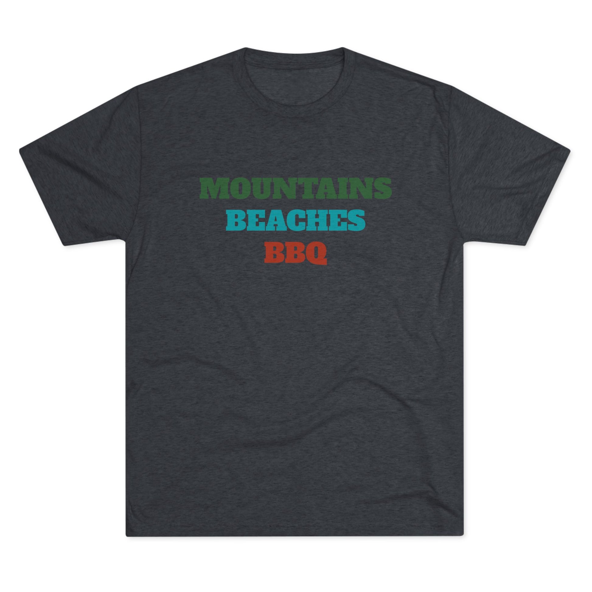 Mountains Beaches BBQ T-shirt in deep green, teal, and rust red stacked text on a dark navy tri-blend shirt.
